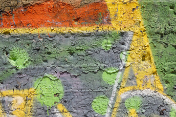 Multi colors dripped paint on old concrete wall background. Natural paintbrush strokes and textured rough cement