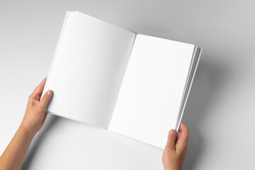 open Empty Book Template on White Background, hands Open book with blank pages. Mock up for design - Powered by Adobe