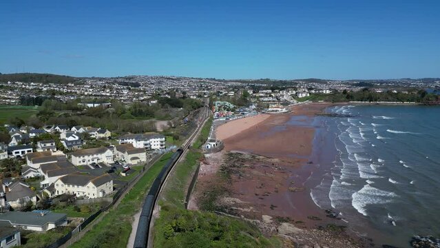 Goodrington Sands, South Devon, England: DRONE VIEWS: A steam train on route to Paignton on the Torbay Steam Railway line. The steam trains are a major tourist attraction for UK holidaymakers.