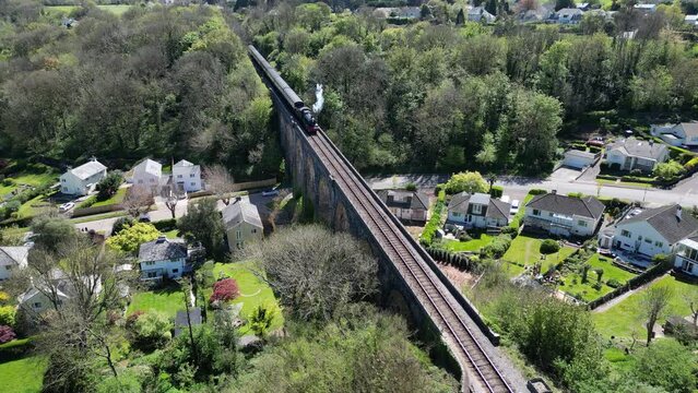 Broadsands, Torbay, South Devon, England: DRONE VIEWS: A steam train on route to Paignton on the Torbay Steam Railway line. The steam trains are a major tourist attraction for UK holidaymakers.