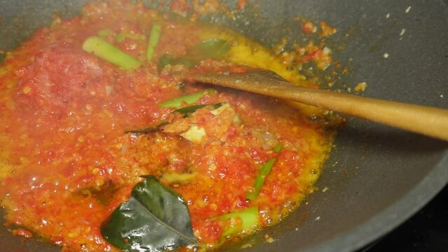 the process of cooking spicy spices or chili sauce, a homemade recipe for marinating chicken, fish, shrimp, or other proteins