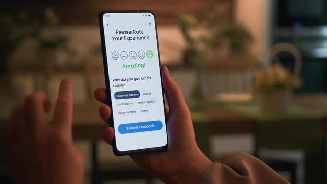 Leaving positive customer feedback via an application on a smartphone. Good customer experience and nice performance. Customer satisfaction concept.
