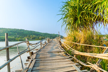 Fototapeta premium View of Ong Cop bridge or Tiger wooden bridge, Vietnam's longest wooden bridge in Chi Thanh district, Phu Yen province, Vietnam
