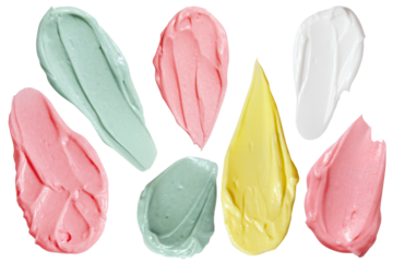Pink, yellow, green and white cream smears on empty background