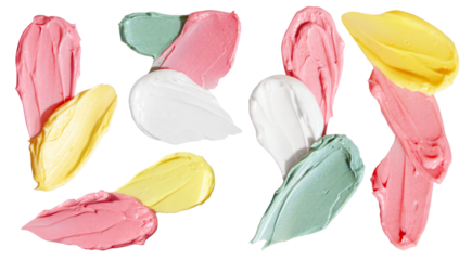 Pink, yellow, green and white cream smears on empty background