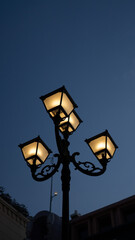 Fototapeta na wymiar An antique chandelier is lit by electricity