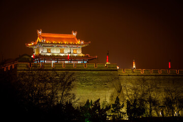 Illuminated historic city wall of Xi'An by night, Shaanxi province China