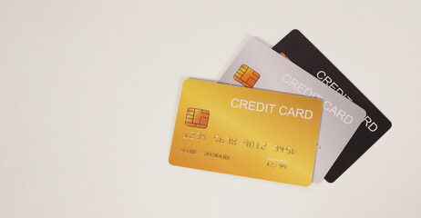 Three credit cards on white background.