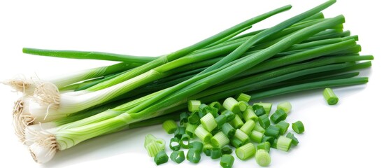Fresh green onions that have been chopped and are isolated on a white background, viewed from the top.