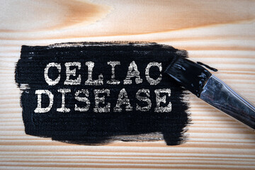 Celiac Disease. Melna krāsa un krāsas ota uz koka tekstūras fona - obrazy, fototapety, plakaty