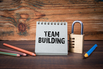 Team building. Cardboard notepad on wooden texture table - 790980847
