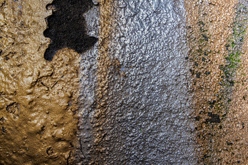 Gold and silver painted concrete wall texture