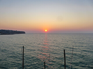 Obraz premium Panoramic sunset view at the Gargano Coast, Apulia, Italy, Europe. Romantic summer vibes at the Mediterranean Adriatic sea. Tranquil calm atmosphere on the beach. Luxury resort in Southern Italy