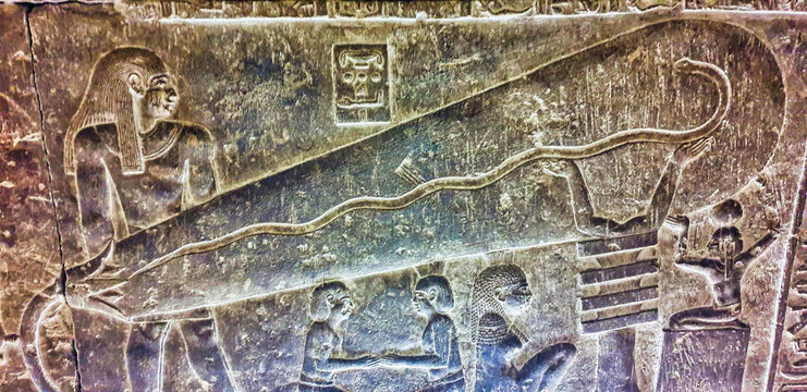 The Dendera lightbulb in the crypt depicting the egyptian creation myth of the snake,Harsomtus,emerging from a lotus,supported by djed pillar in the Temple of Hathor at Dendera near Abydos town,Egypt