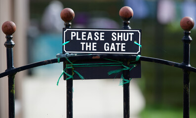 Please close gate sign at entrance to residential garden