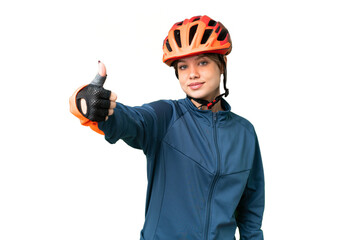 Young cyclist girl over isolated chroma key background giving a thumbs up gesture