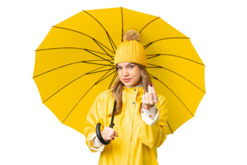 Young girl with rainproof coat and umbrella over isolated chroma key background making money gesture