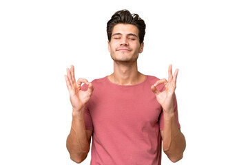 Young handsome caucasian man over isolated background in zen pose