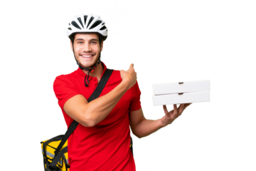Pizza delivery man with work uniform picking up pizza boxes over isolated background pointing back