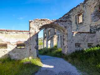Ruins of a fortress along scenic mtb trail along ancient pathway from the Alps to the sea, through...