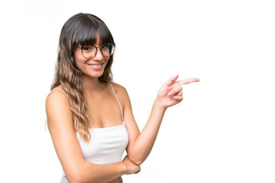 Young caucasian woman over isolated background pointing finger to the side