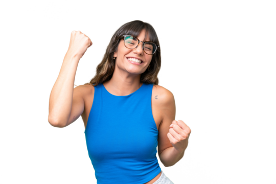 Young caucasian woman over isolated background celebrating a victory