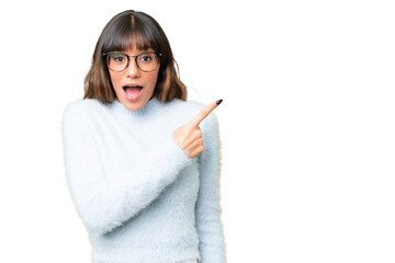 Young caucasian woman over isolated chroma key background surprised and pointing side