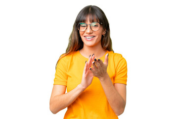 Young caucasian woman over isolated chroma key background applauding after presentation in a...