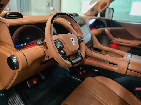 BYD Yangwang U8 steering wheel, shift lever and dashboard, climate control, speedometer, display. Salon of a new stylish car. Chinese BYD manufacturer. 