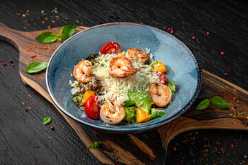 Caesar and shrimp salad. Menu for a pub on a dark background. Colorful juicy food photography.