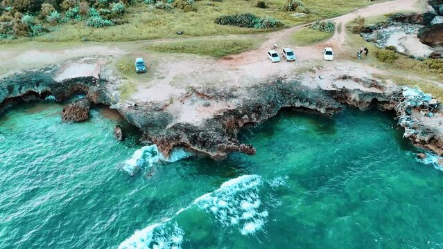 Aerial footage of the Indian Ocean waves crashing on the Coco Beach Cliff in Dar es Salaam, Tanzania