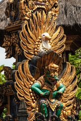 Bali MARCH 2024 - Colorful golden stone god figures inside a temple, Bali, Indonesia