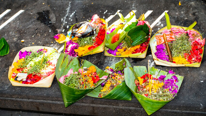 Bali MARCH 2024 - Traditional balinese handmade canang sari offering to gods on a street. Bali...