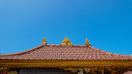 Fototapeta na wymiar Bali MARCH 2024 - Tradition Balinese roof in temples, Bali, Indonesia.