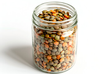 Lentils in a transparent glass jar. White background