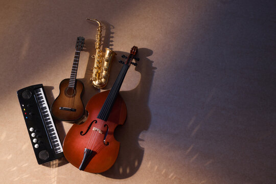 International Jazz or music day. Violin and Saxophone in Warm Light