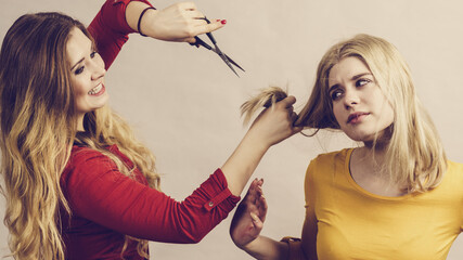 Woman with scissors ready to hair cutting