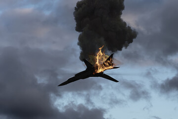 A Russian strategic bomber is hit by a missile and crashes, burning and falling against a...