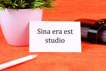 Sina era est studio It means Without anger and addiction it is written on a white business card...
