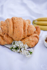 croissant and blossom on picnic