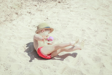 Happy child playing by the sea on nature background