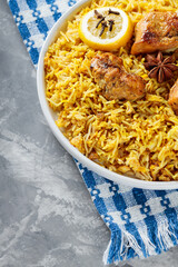 Indian Dish Chicken Biryani with Basmati Rice on White Plate, Close-up