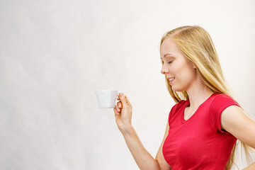 Blonde girl with coffee cup