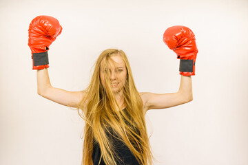 Woman in red gloves with arms up