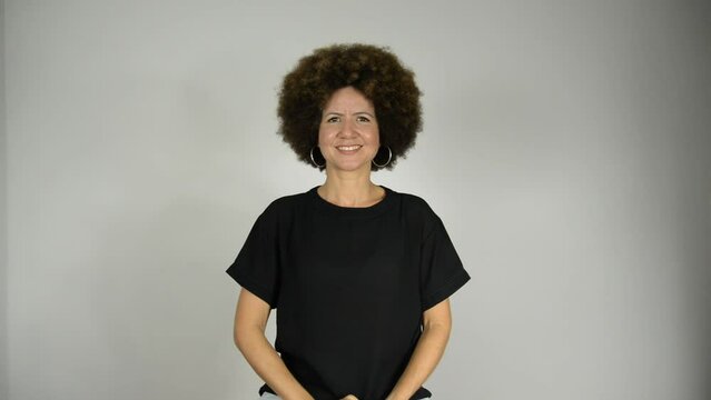 Female interpreter saying be happy in Brazilian sign language.