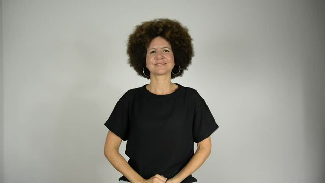 Female interpreter saying love moves the world in Brazilian sign language.