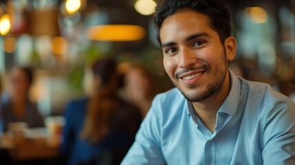 Fototapeta premium oung Hispanic Man in Light Blue Shirt at Informal Interview