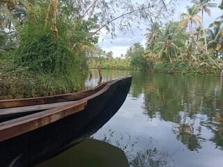 A canoe is a lightweight narrow water vessel, typically pointed at both ends and open on top, propelled by one or more seated or kneeling paddlers facing the direction of travel and using paddles.
