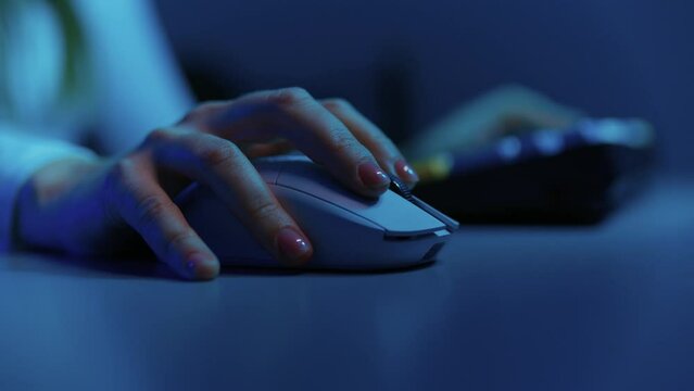 close up of pro cyber sport gamer hands play game with RGB keyboard and mouse