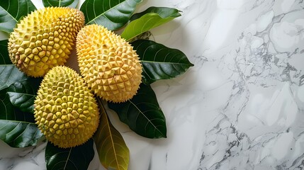 Jackfruits lie on the white marble countertop